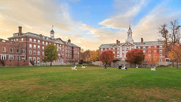 Harvard University brick buildings and lawn in the fall